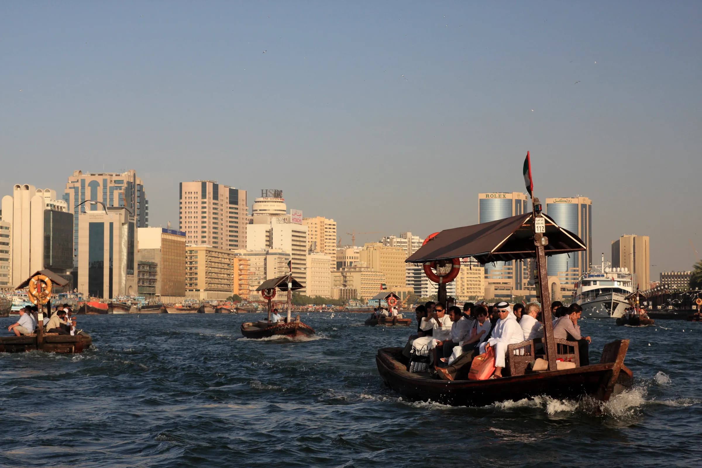 Traditional abra boats crossing Dubai Creek